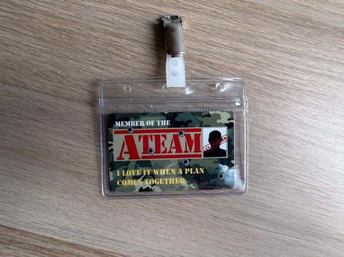 The team plastic badge - a,